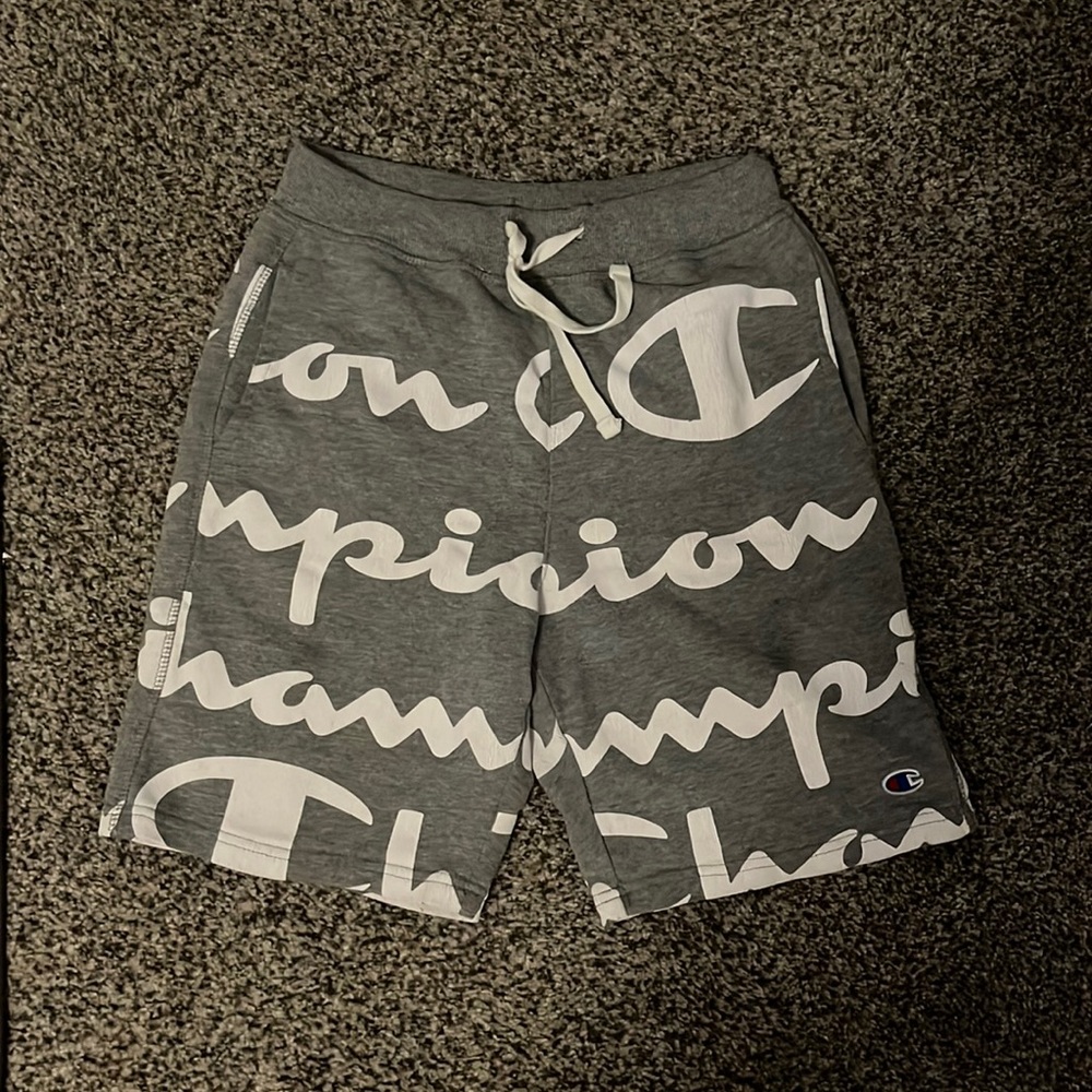 All grey champion shorts with white champion lettering